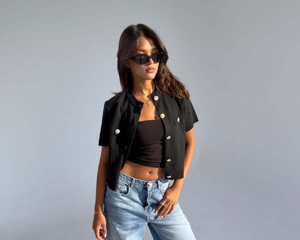 Model wearing the Gold Buttoned Top in Black from the LAM Studios Studio Contrast edit